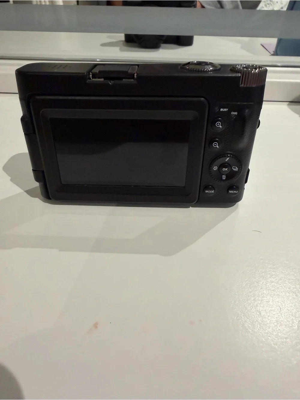 Compact Black Digital Camera with Flip Screen